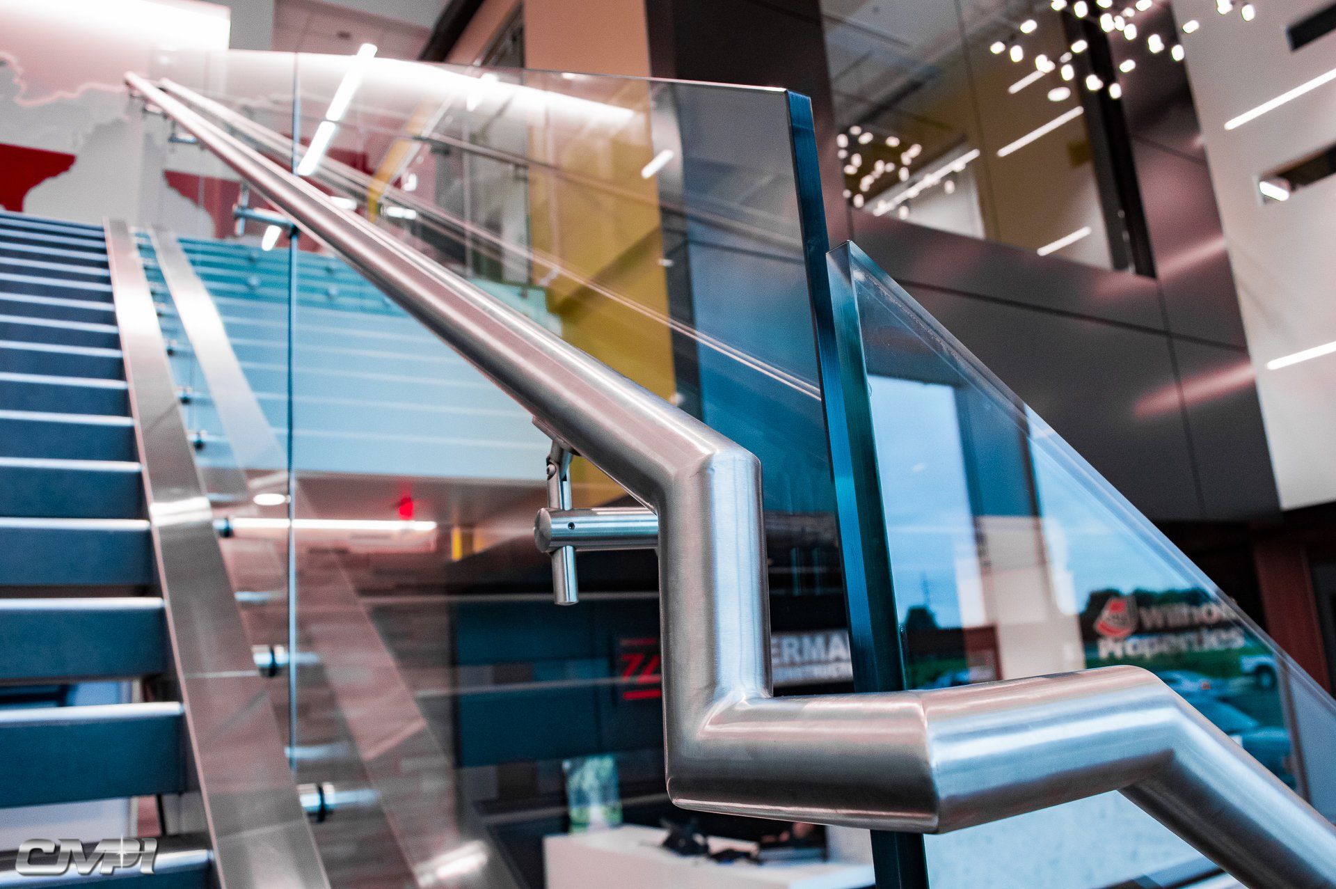 Custom Stainless Steel Glass Guardrail at Zimmerman Building, by Custom Manufacturing & Polishing, Inc.