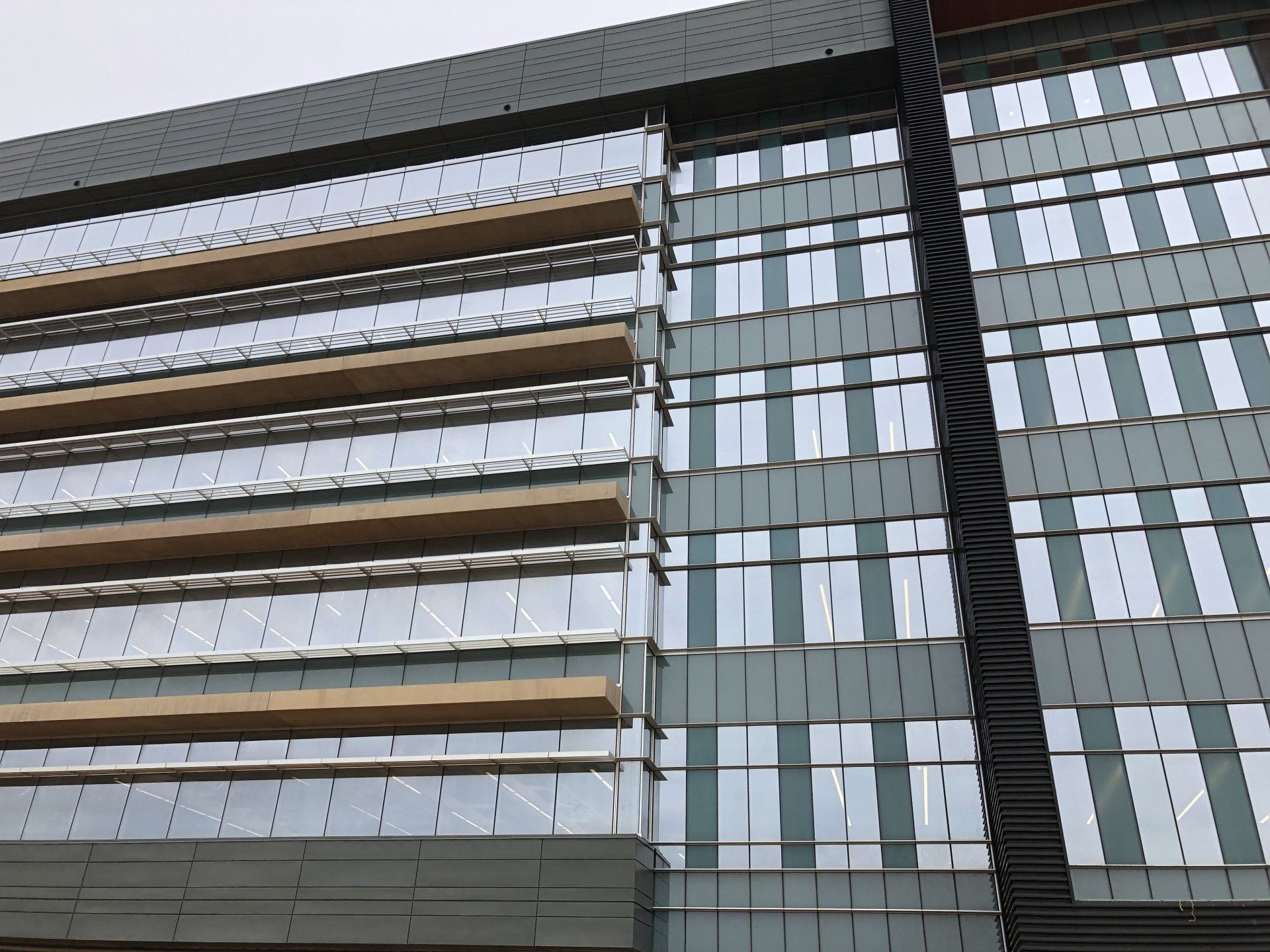 A tall building with a lot of windows and balconies