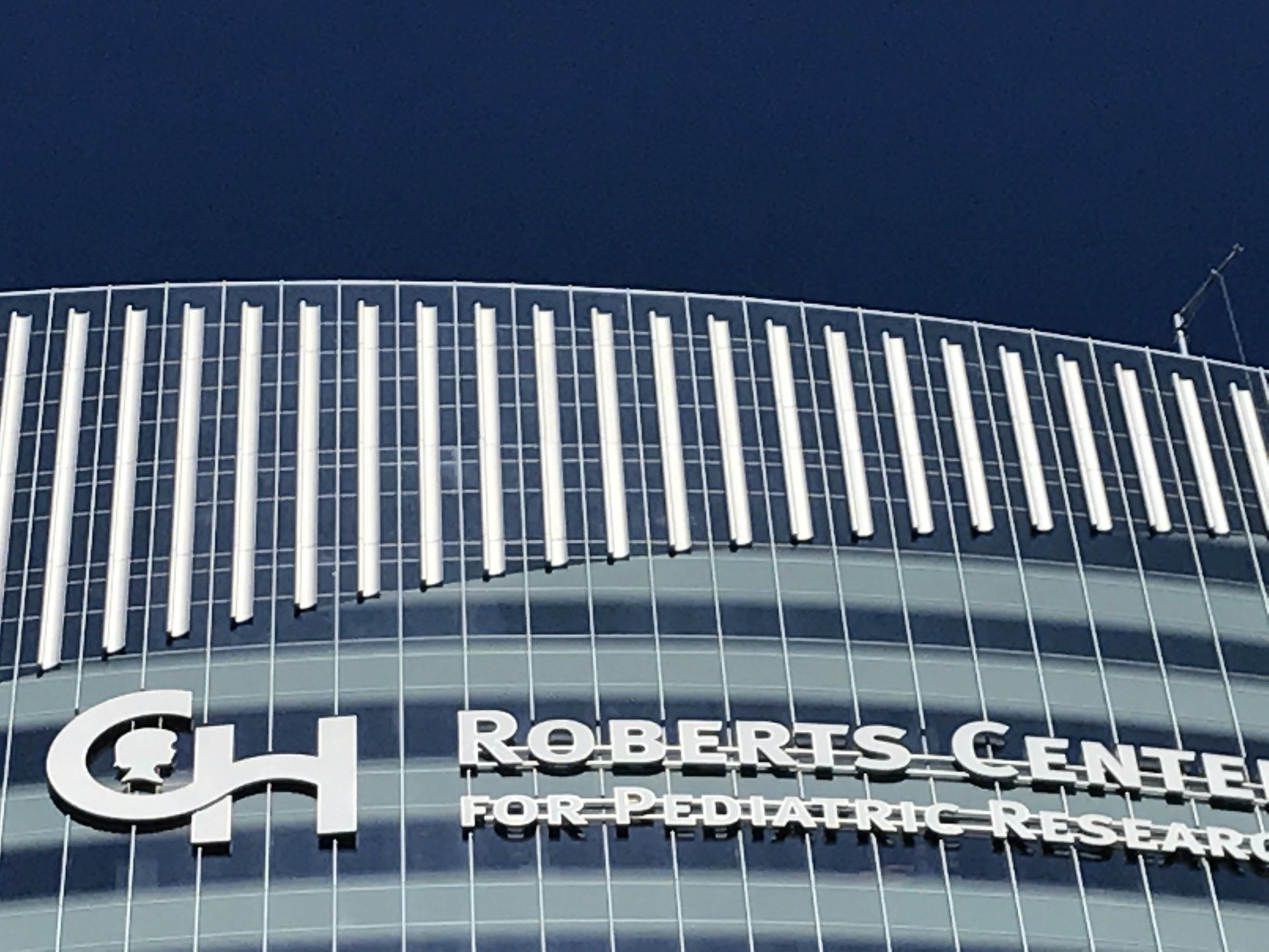 The roberts center for pediatric research has a blue sky in the background