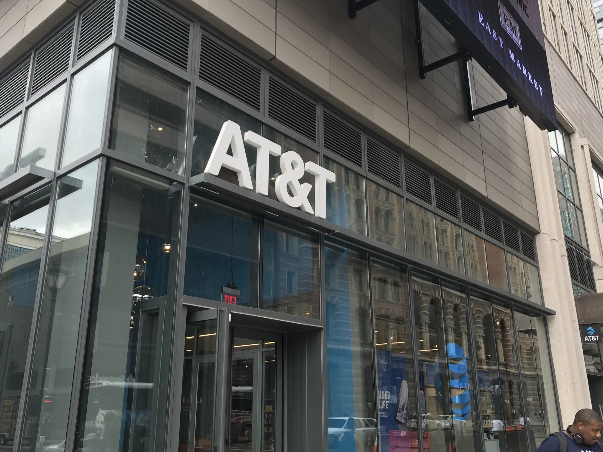 An at & t store is located on the corner of a building