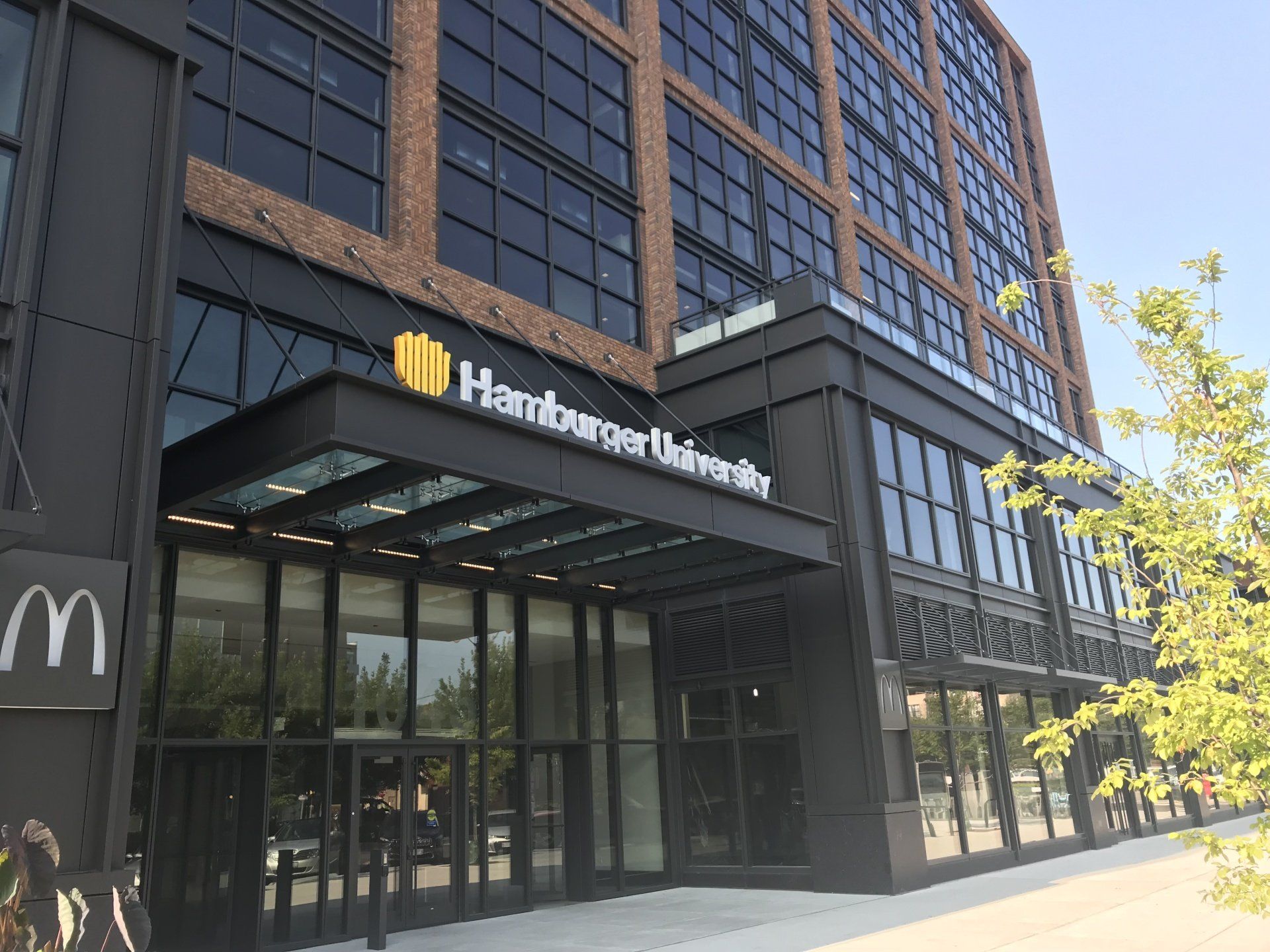 A large building with a sign that says hamburger university