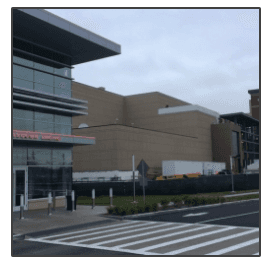 A large building with a red sign that says emergency room