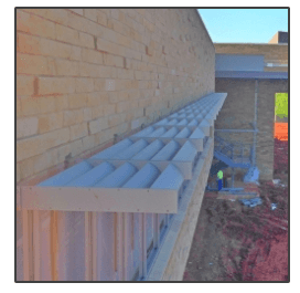 A picture of a brick wall with a canopy on it