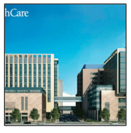 A picture of a healthcare building with a blue sky in the background