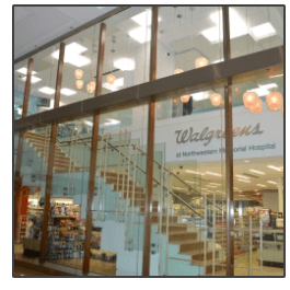 A walgreens store with stairs going up to the second floor