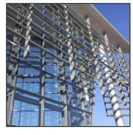 A building with a lot of windows and a blue sky in the background