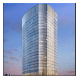 A tall building with a blue sky in the background