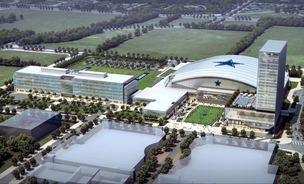 An aerial view of a large building with a blue star on the top