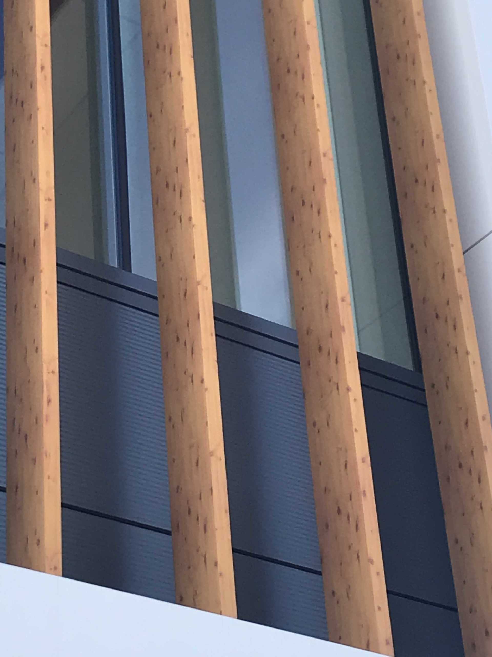 A building with a wooden railing and a window