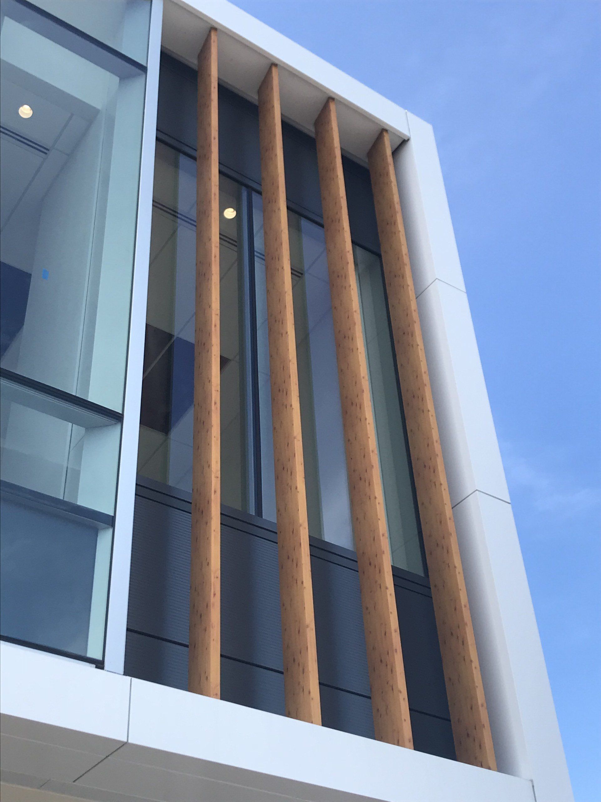 A building with a lot of windows and a blue sky in the background