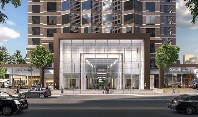 An artist 's impression of the entrance to a tall building.