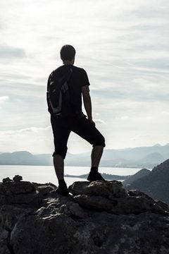 person standing on mountain