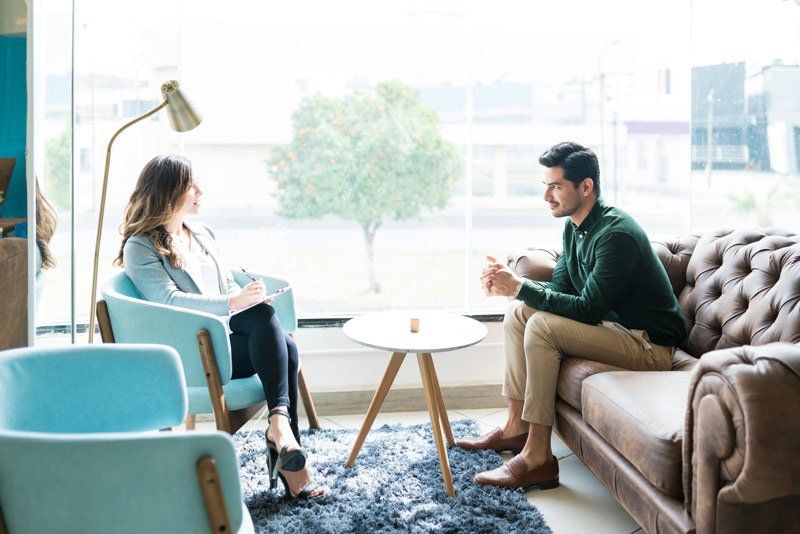 man and woman talking