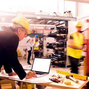 People working with hard hats image