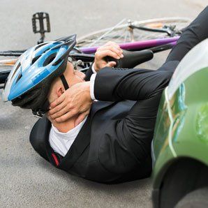 Man on ground from accident image