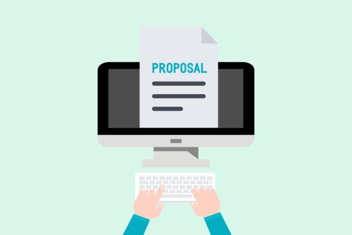 Hands typing on a keyboard in front of a computer displaying a proposal document