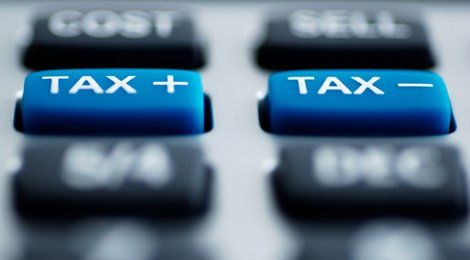 Blue keyboard buttons with the words TAX+ and TAX- in white