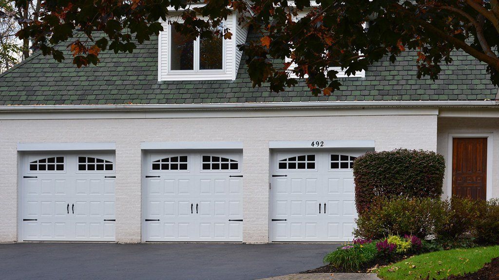 Three White Garage Door — Central Square, NY — Bonnet Sales & Service, Inc.