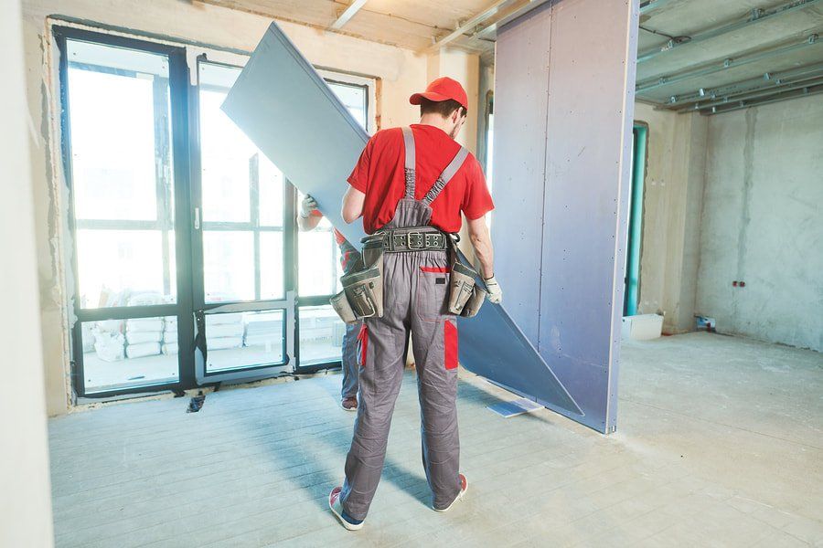 workers preparing to install drywall in Orange County, CA