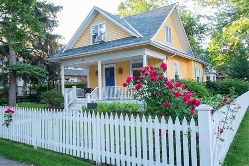 House with White Picket Fence — Pascagoula, MS — Gulf Coast Fence Co. House with White Picket Fence — Pascagoula, MS — Gulf Coast Fence Co.