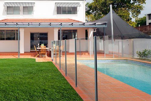 Residential Pool with Glass Fence — Pascagoula, MS — Gulf Coast Fence Co.
