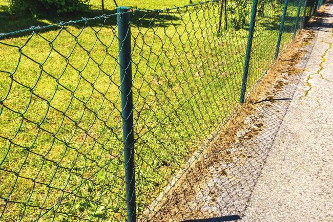 Vinyl Coated Chain Link Fence — Pascagoula, MS — Gulf Coast Fence Co. Vinyl Coated Chain Link Fence — Pascagoula, MS — Gulf Coast Fence Co.