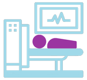 A person is laying on a bed in front of a monitor.