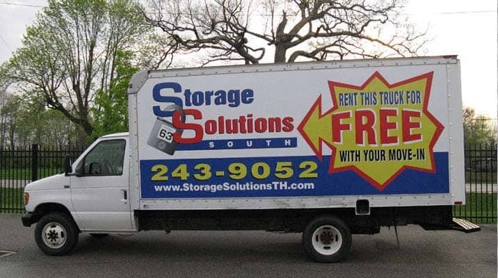 White truck for Storage Solutions South, advertising free truck rental with move-in.