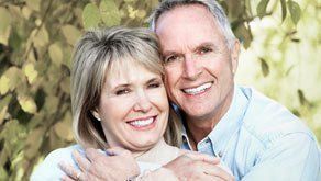A smiling couple with healthy-looking teeth