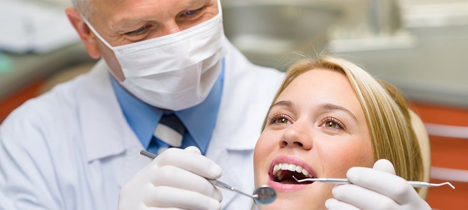 A dentist with a female patient