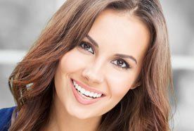 A young lady showing off her white smile