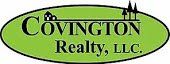 A green oval logo for covington realty , llc.