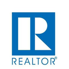 A blue and white realtor logo on a white background.