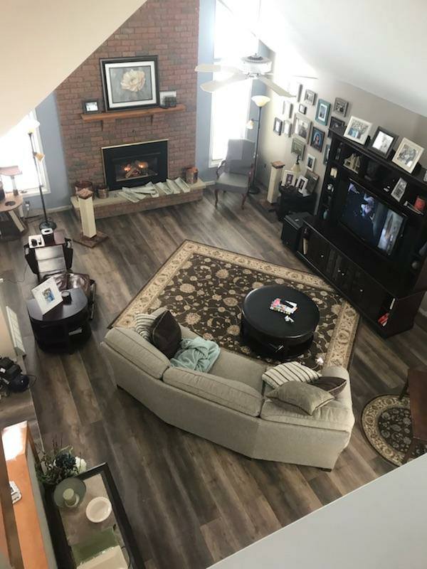 Luxury Vinyl — Living Room with Fireplace in Hamburg, NY