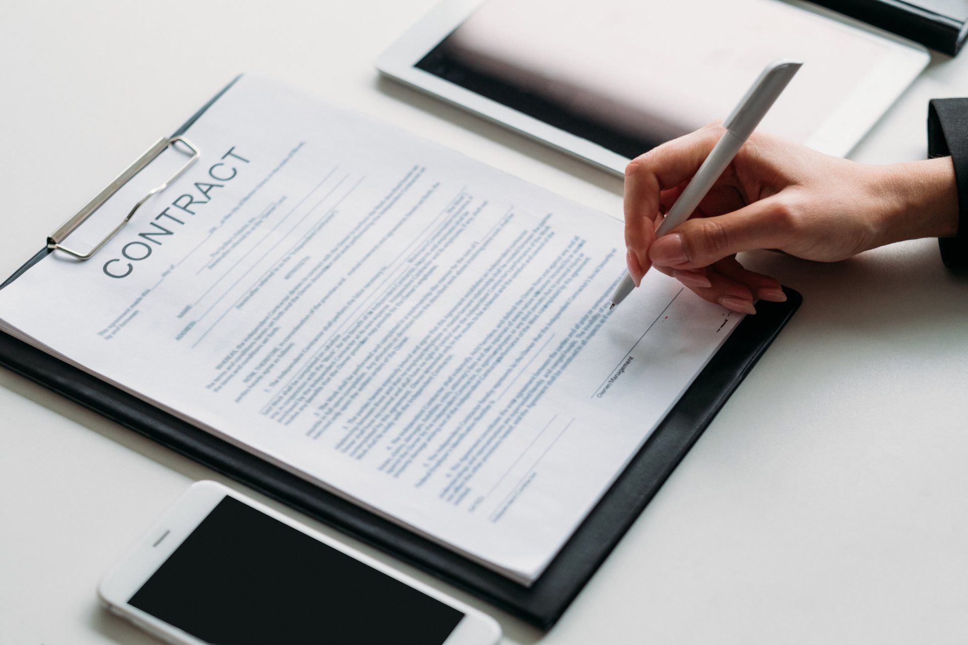 Signing Contract ─ Grand Island, NE ─ Bradley Law Firm, PC