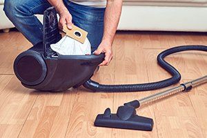 Shark — Man Replacing a Dust Bag to Vacuum Cleaner in Wilmington, NC Shark — Man Replacing a Dust Bag to Vacuum Cleaner in Wilmington, NC