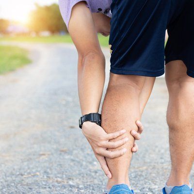 Leg Pain — Man Holding on His Calf In Cotuit, MA Leg Pain — Man Holding on His Calf In Cotuit, MA