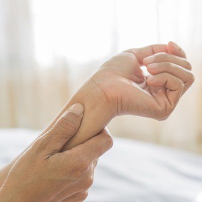 Arm Pain — Woman Holding on Her Arm In Cotuit, MA Arm Pain — Woman Holding on Her Arm In Cotuit, MA