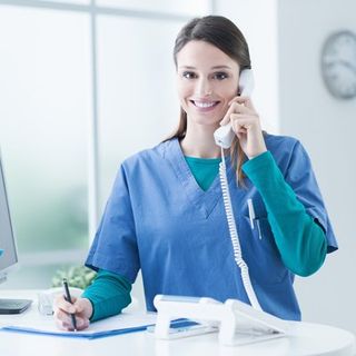 Chiropractic Treatment — Chiropractor Holding a Phone In Cotuit, MA Chiropractic Treatment — Chiropractor Holding a Phone In Cotuit, MA