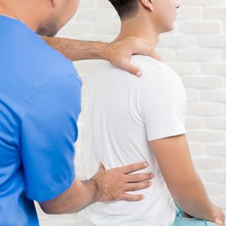 Chiropractic Care — Chiropractor Stretching Patient's Back In Cotuit, MA Chiropractic Care — Chiropractor Stretching Patient's Back In Cotuit, MA