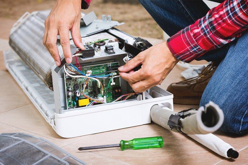 repairing air conditioner unit