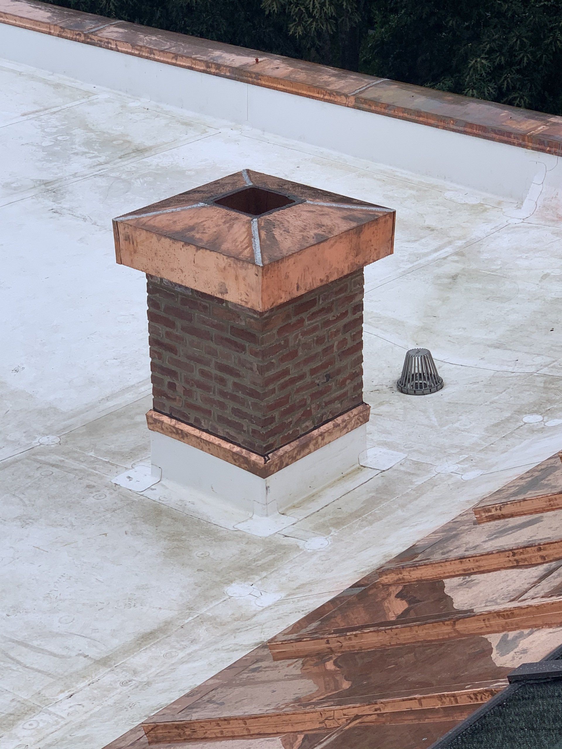 Chimney with copper roofing in Vermont