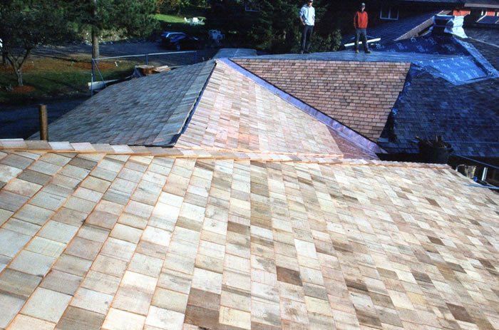 Tan wood shingles roof on a house in Vermont