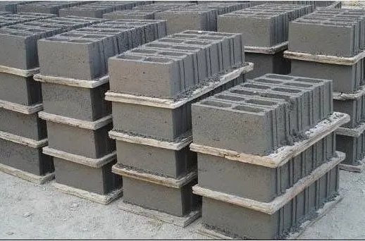 A stack of concrete blocks sitting on top of each other on pallets.