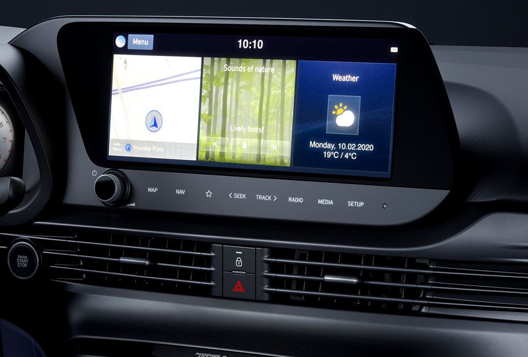 A close up of a car dashboard with a navigation system i20