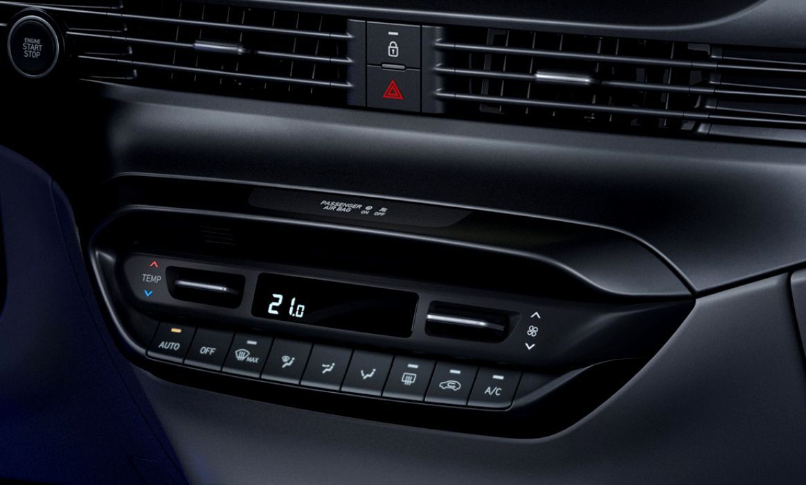 A close up of a car dashboard with a display that says 21 degrees celsius i20