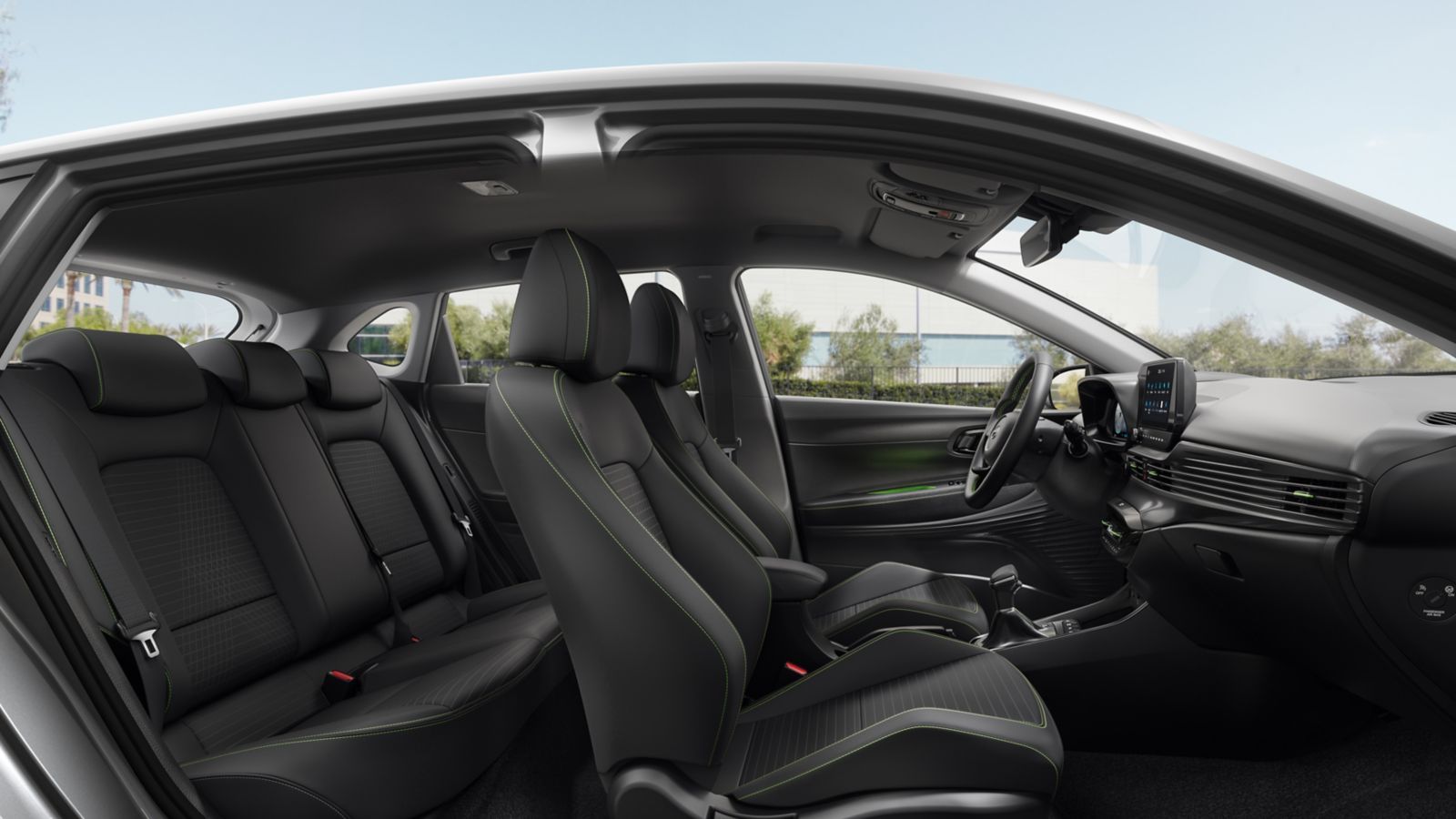 The interior of a white car with black seats and a steering wheel.