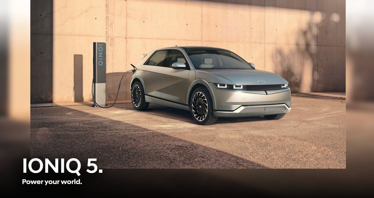 A hyundai ioniq 5 is being charged at a charging station.