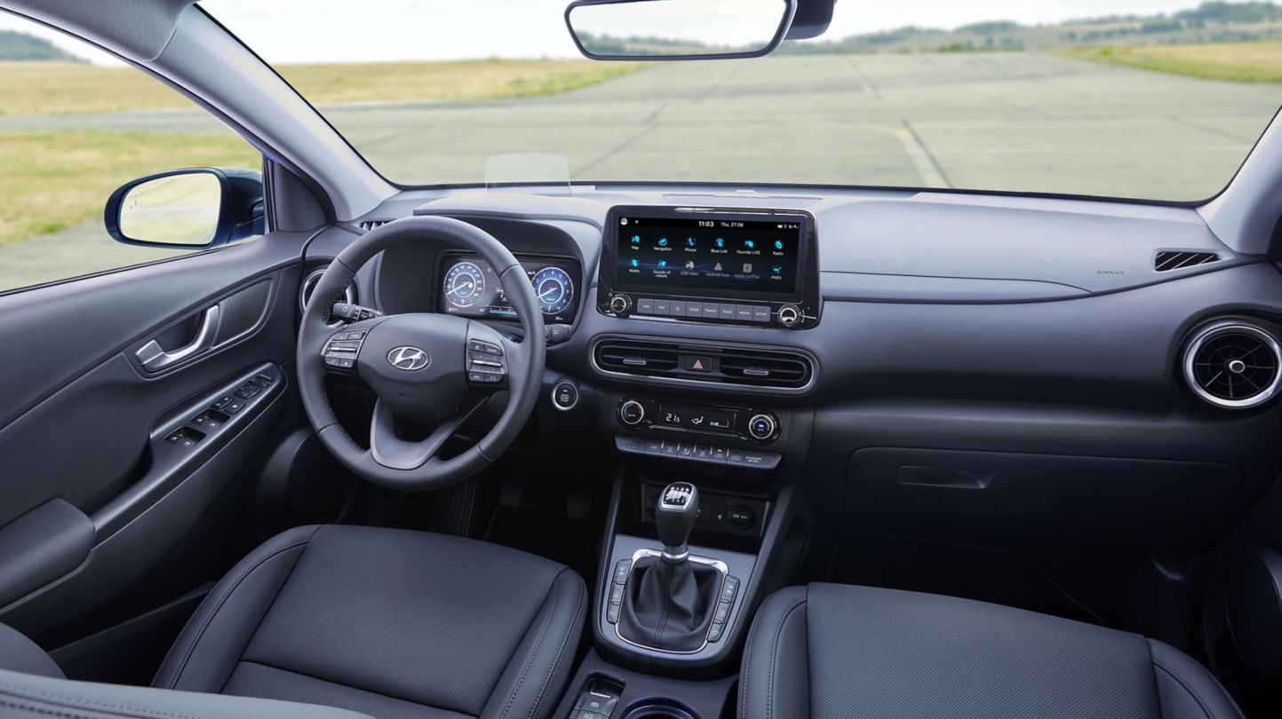 The interior of a hyundai kona electric car is shown.