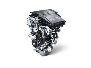 A close up of a car engine on a white background.